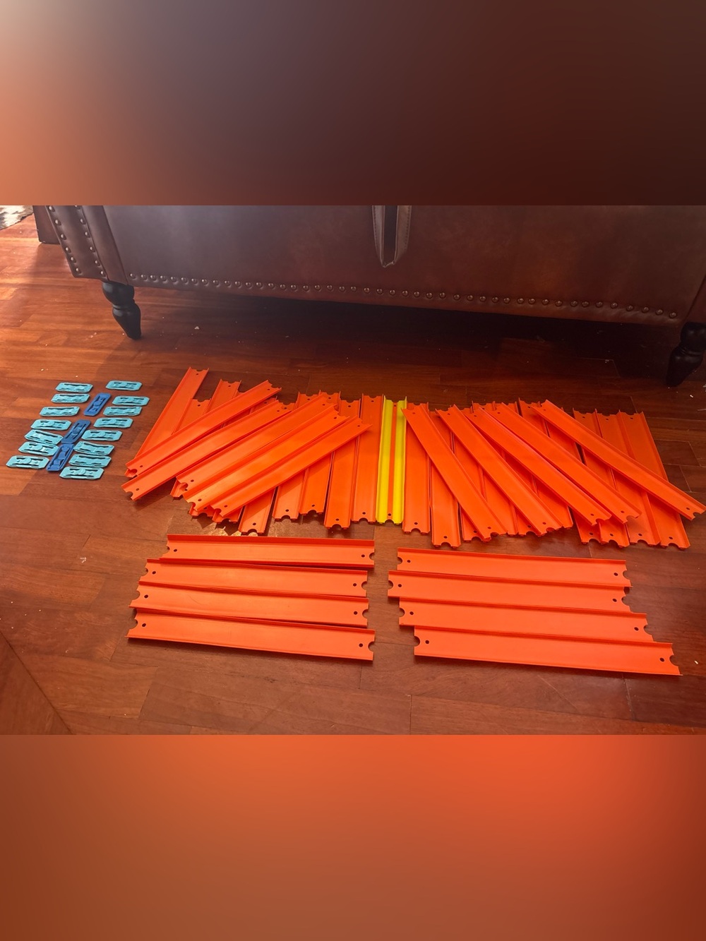Interlocking Orange Race Track Panels with Blue Connector Clips